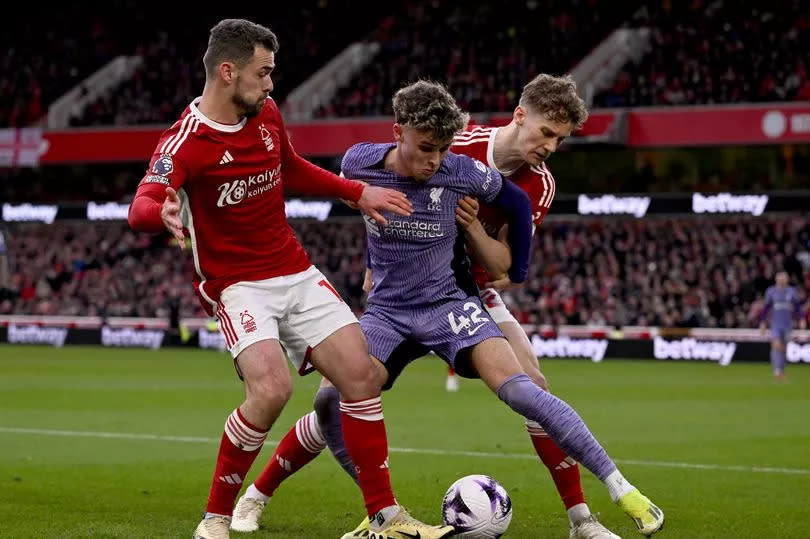 Bobby Clark of Liverpool competing with Ryan Yates of Nottingham Forest during the Premier League match between Nottingham Forest and Liverpool FC at City Ground on March 02, 2024 in Nottingham, England.