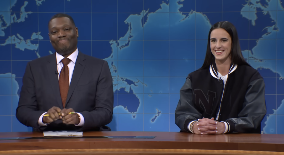 Closeup of Michael Che and Caitlin Clark on "SNL"