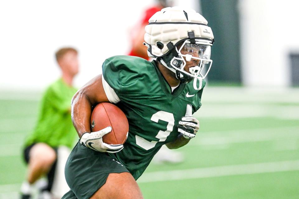 Michigan State running back Jarek Broussard runs the ball during practice on Thursday, Aug. 4, 2022, in East Lansing.