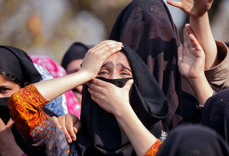 Women wail as they watch the body of Zubair Ahmed Turay, a suspected militant, being carried away during his funeral procession in south Kashmir's Shopian district April 1, 2018. REUTERS/Danish Ismail
