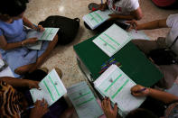 Bangkok district officers prepare ballot boxes and other documents ahead of the general election at a local district office in Bangkok, Thailand, March 23, 2019. REUTERS/Athit Perawongmetha