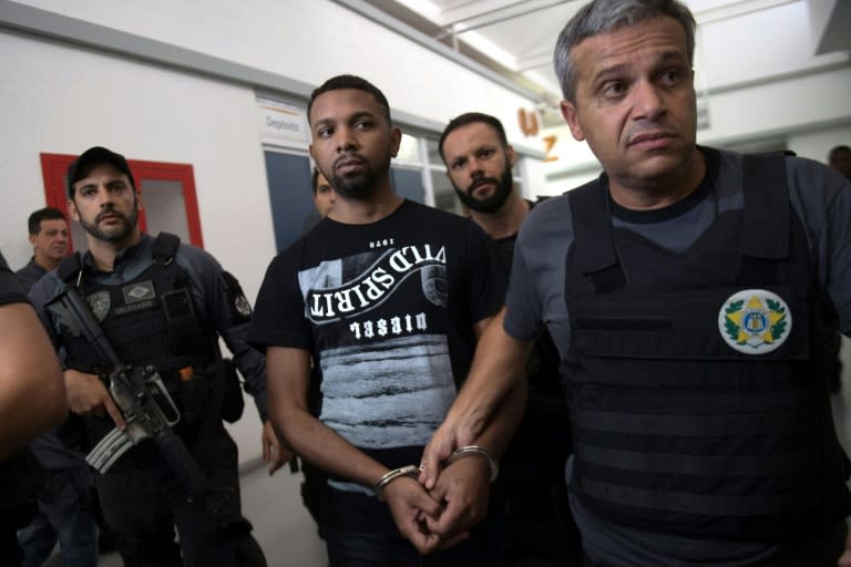 Alleged Rocinha favela drug boss Rogerio Avelino da Silva, nicknamed "Rogerio 157," is escorted by Brazilian Civil Police at the police headquarters, after being arrested in Rio de Janeiro