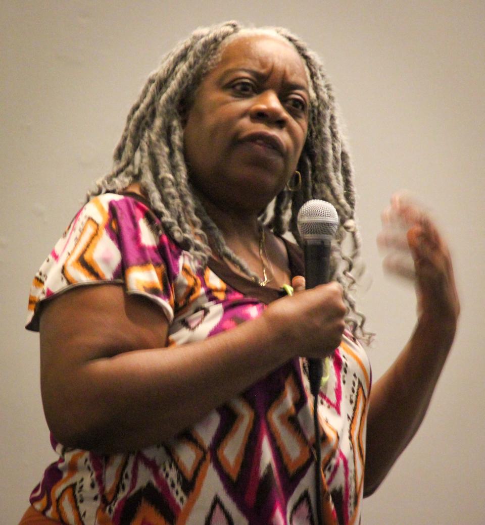 Deb Britt of the National Black Doll Museum in Mansfield talks about her group's experience applying for a Mass Humanities grant before a crowd at Fall River's Heritage State Park visitor's center.