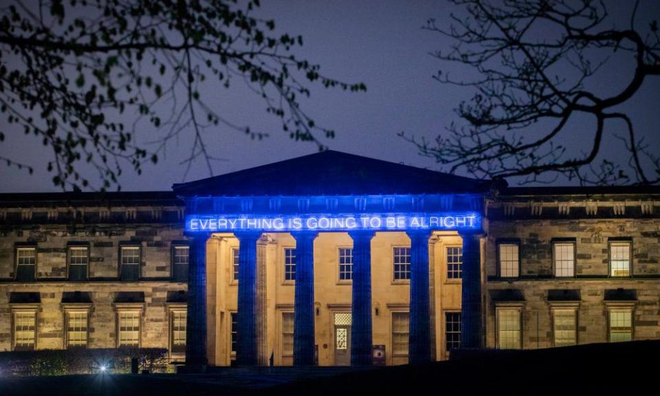 The neon lights over museum entrance reading “Everything is Going to be Alright” .