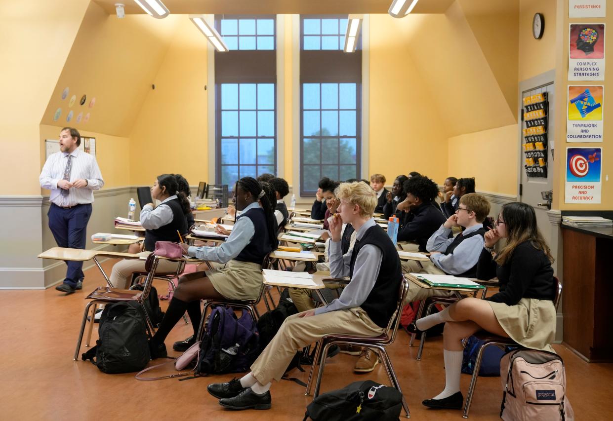 Students listen during chemistry class at Cristo Rey Columbus High School on May 15. The Downtown school celebrated it's 10th school year and prides itself on all of its students being accepted into college.