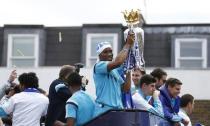 Football - Chelsea - Barclays Premier League Winners Parade - Chelsea & Kensington, London - 25/5/15 Chelsea's Didier Drogba celebrates with the Barclays Premier League trophy as celery is thrown during the parade Action Images via Reuters / Peter Cziborra Livepic