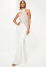 <p><a rel="nofollow noopener" href="https://www.missguided.co.uk/bridal-white-high-neck-lace-detail-maxi-dress" target="_blank" data-ylk="slk:Missguided, £120;elm:context_link;itc:0;sec:content-canvas" class="link "><i>Missguided, £120</i></a> </p>