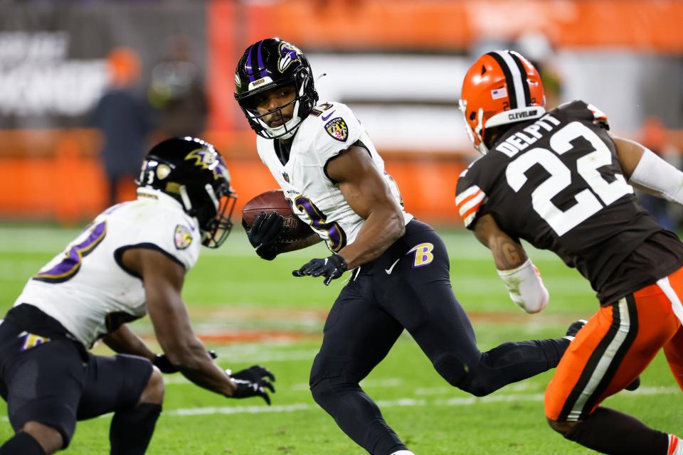 Baltimore Ravens wide receiver Devin Duvernay carries the ball against the Cleveland Browns on Dec. 17, 2022, in Cleveland.