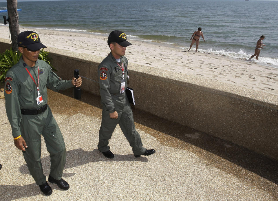 FILE - In this Thursday, Oct. 22, 2009, file photo, soldiers patrol with a mobile explosive detector GT 200 outside a hotel in Cha-Am, a resort town in southern Thailand. Cha-Am is the venue for the 15th ASEAN Summit meeting. (AP Photo/Sakchai Lalit, File)