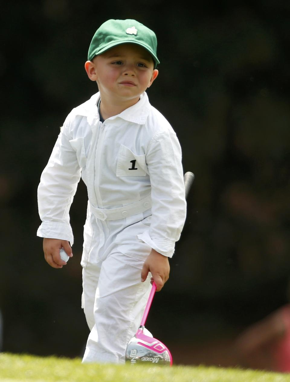 U.S. golfer Bubba Watson's son Caleb takes part with his mother and father in the par 3 event at Augusta National golf course, ahead of the 2015 Masters in Augusta, Georgia April 8, 2015. REUTERS/Phil Noble