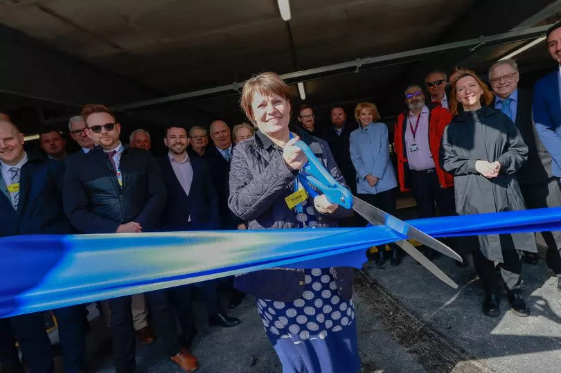 Chief Executive of UHNM Tracey Bullock cuts the ribbon to officially open the car park. -Credit:Stoke Sentinel