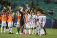 Paraguay players acknowledge the crowd after a Copa America Group B soccer match against Colombia at the Arena Fonte Nova in Salvador, Brazil, Sunday, June 23, 2019. (AP Photo/Natacha Pisarenko)