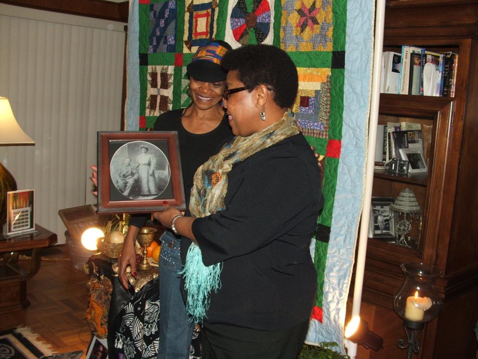 Kwame Mumina and his family have celebrated Kwanzaa for over 50 years. A family member discusses a photo of great great grandparents who were once slaves.