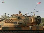 A Turkish army soldier on a tank makes his way towards the Syrian border town of Jarablus, Syria August 24, 2016. Picture taken August 24, 2016. Revolutionary Forces of Syria Media Office/Handout via REUTERS