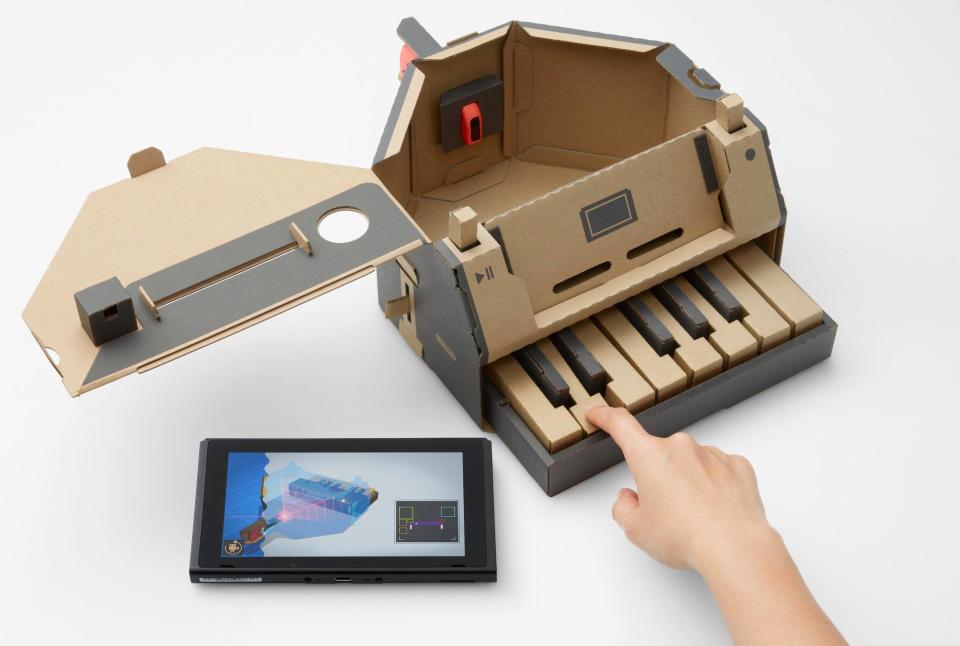 The Toy-Con Piano uses the Joy-Con’s infrared camera to read small white stickers attached to each key to play notes.