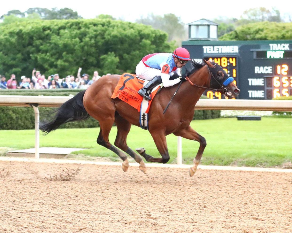 Muth and jockey Juan Hernandez win the Arkansas Derby on March 30 at Oaklawn Park.