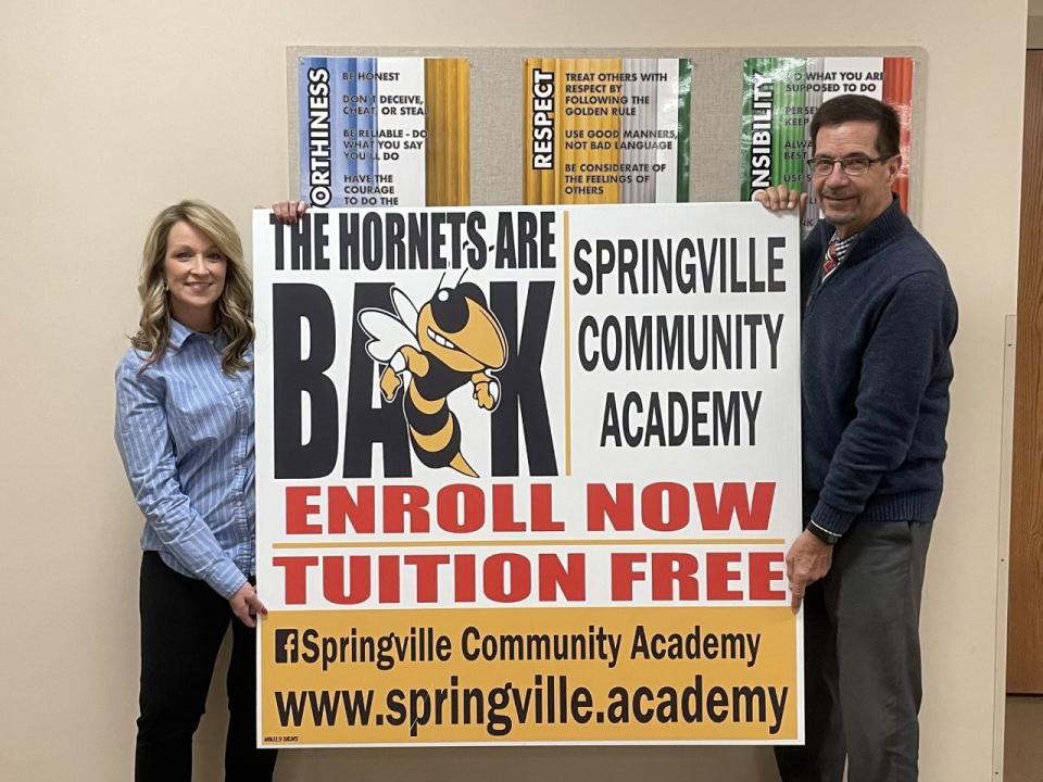 Jayme Davis and Gary Conner pose together at Springville Community Academy