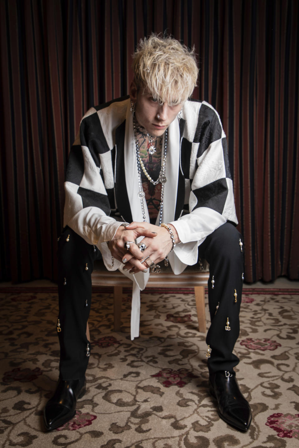 FILE - Actor-musician Colson Baker, also known as Machine Gun Kelly, poses for a portrait to promote the film "Taurus" during the International Film Festival Berlin 'Berlinale', in Berlin, Germany on Feb. 13, 2022. Baker plays Cole Taurus, a troubled rocker searching endlessly for the inspiration to record one final song. (Photo by Vianney Le Caer/Invision/AP, File)