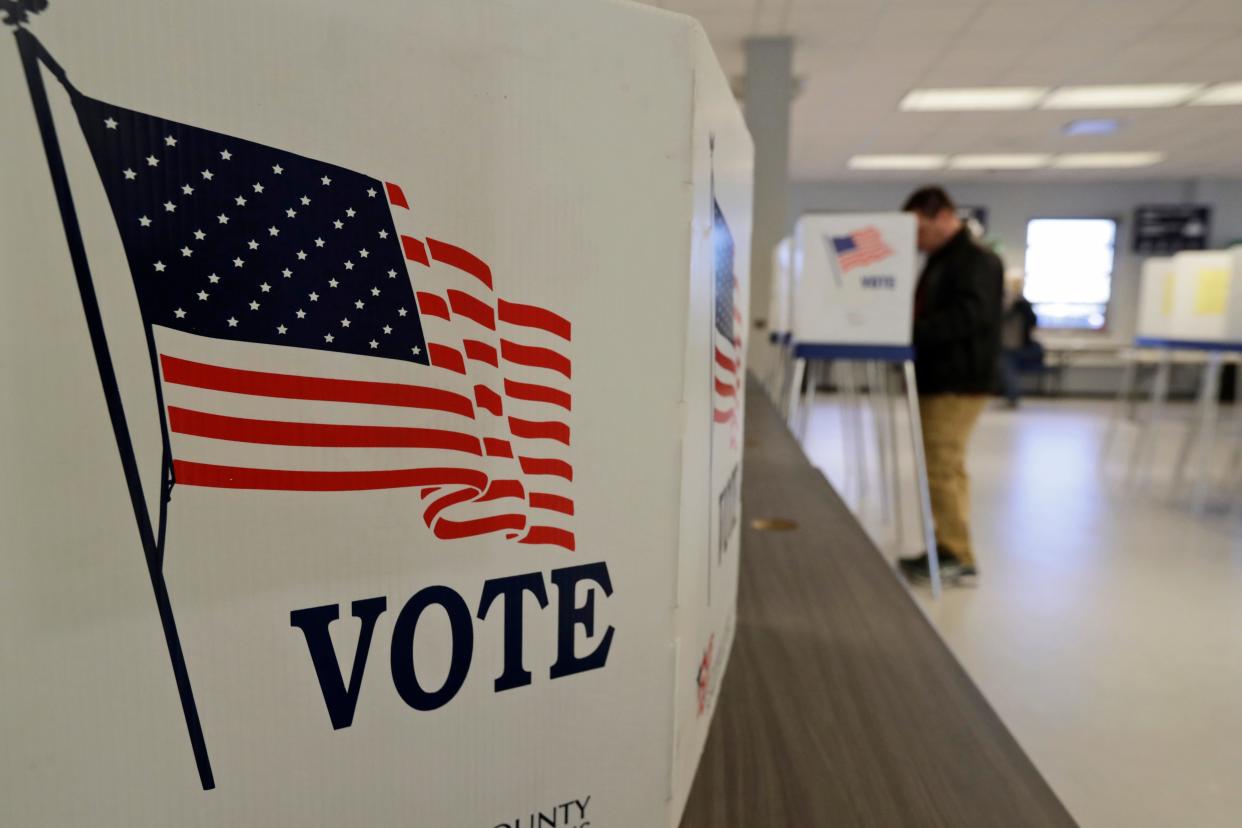 A man votes during early voting March 13, 2020, in Cleveland. Despite the uncertainty raised over the date of Ohio’s primary, the state is ready to move forward with early voting on Tuesday ahead of a likely May 3 contest for statewide and congressional races – but not legislative ones. (AP Photo/Tony Dejak, File)