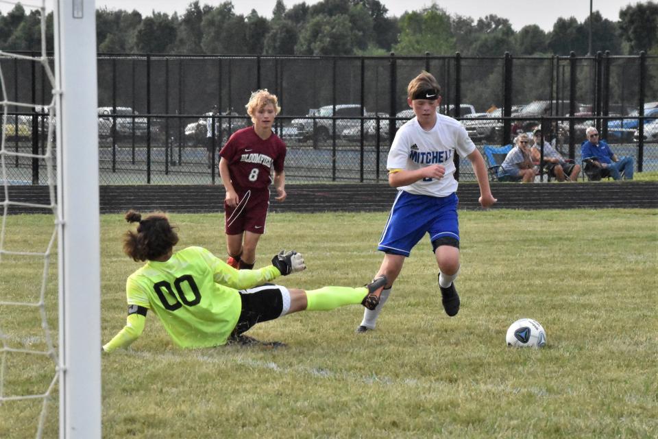 Gibson Glassco beats the Bloomfield keeper with a deft touch. A rallying defender would come from behind to break up the play, but it was one of many scoring opportunities for the Bluejackets in the game.