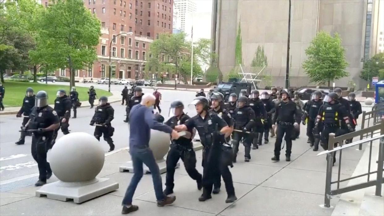 An elderly man appears to be shoved by riot police during a protest against the death in Minneapolis police custody of George Floyd, in Buffalo, New York, U.S. June 4, 2020 in this still image taken from video. WBFO/via REUTERS TV