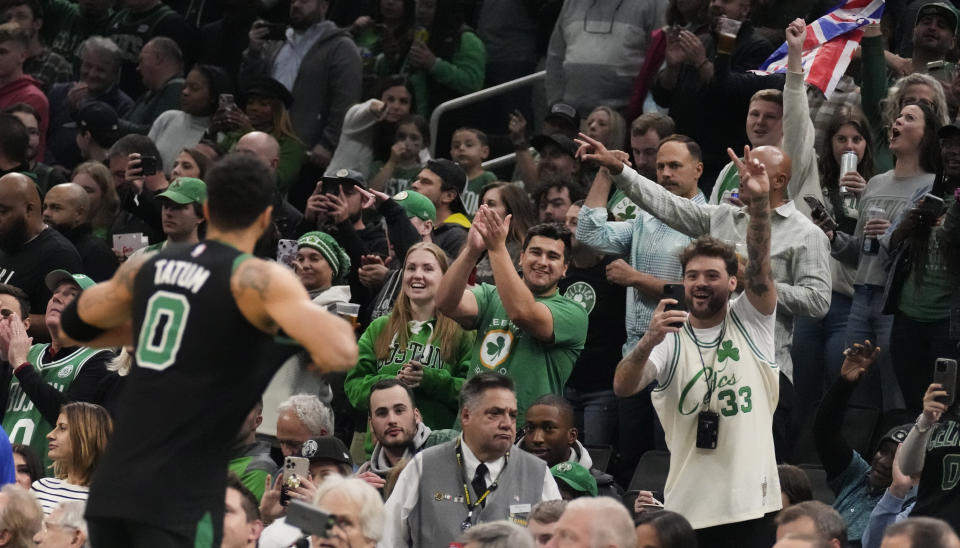 Fans applaud Boston Celtics forward Jayson Tatum (0) before the team's NBA basketball game against the Indiana Pacers, Wednesday, Nov. 1, 2023, in Boston. (AP Photo/Charles Krupa)