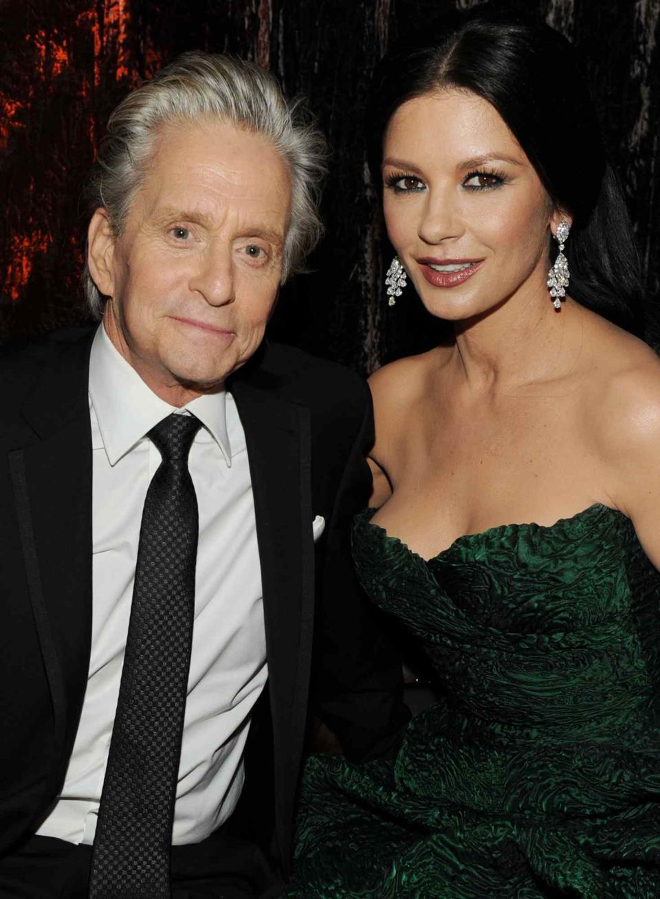 Michael Douglas (L) and wife actress Catherine Zeta-Jones attend Relativity Media and The Weinstein Company's 2011 Golden Globe Awards After Party presented by Marie Claire held at The Beverly Hilton hotel on January 16, 2011 in Beverly Hills, California