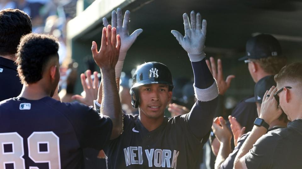 New York Yankees infielder Oswaldo Cabrera (95) celebrates with teammates after he hit a 3-run home run against the Baltimore Orioles.