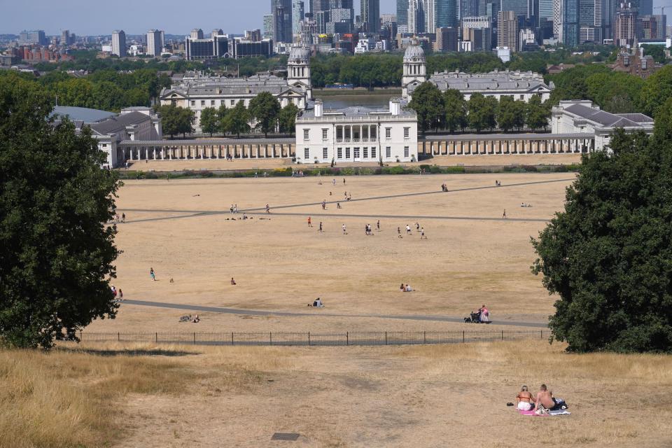 Greenwich Park in London is among those that has been parched in the dry weather (PA)