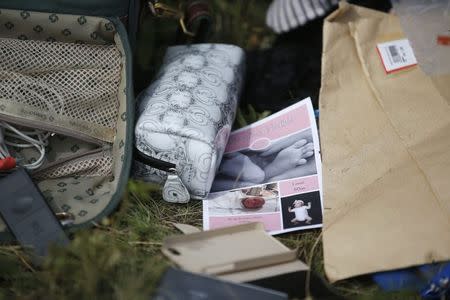 Belongings found at the crash site of Malaysia Airlines Flight MH17 are pictured near the village of Hrabove, Donetsk region, July 20, 2014. REUTERS/Maxim Zmeyev