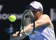 Australia's Ash Barty hits a backhand return to Karolina Muchova of the Czech Republic during their quarterfinal match at the Australian Open tennis championship in Melbourne, Australia, Wednesday, Feb. 17, 2021.(AP Photo/Andy Brownbill)