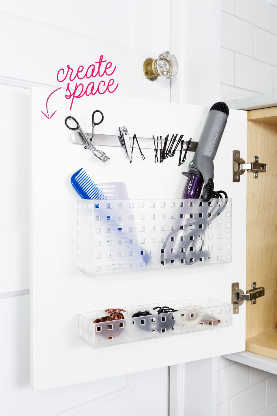 bathroom storage ideas, hair tools in a basket attached to cabinet door