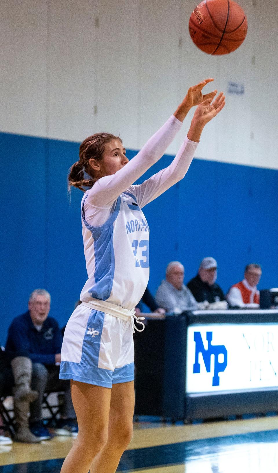 North Penn's Olivia Stone (23) goes for a three-point basket against Pennsbury during their girls' basketball game in Lansdale on Thursday, Dec. 21, 2023.

Daniella Heminghaus | Bucks County Courier Times