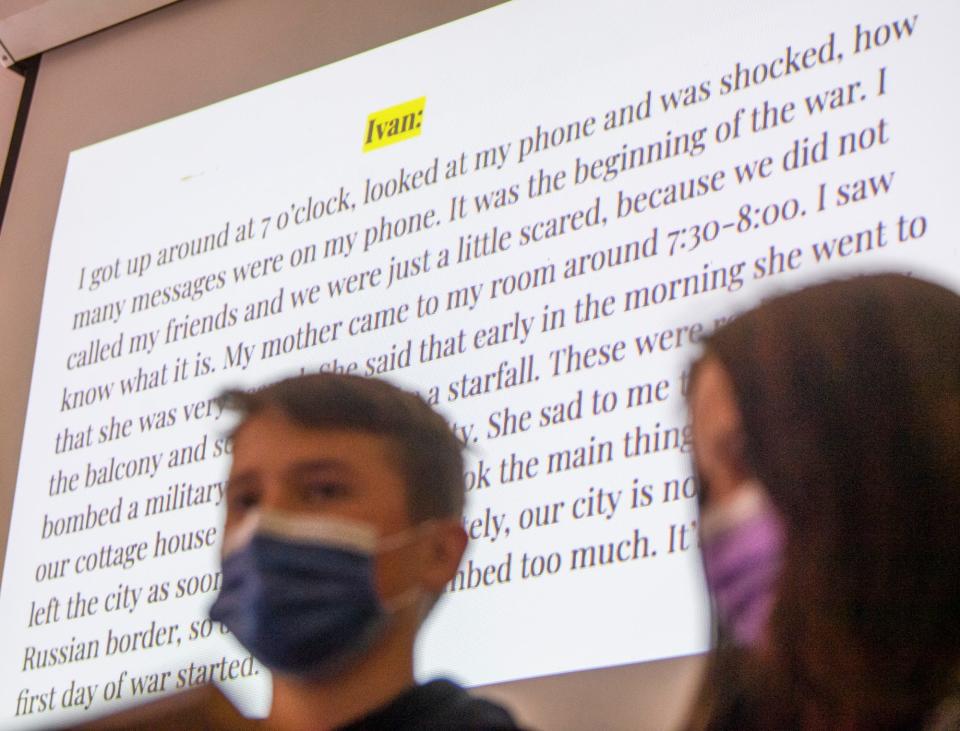 Ivan Kovalyov's words are displayed on a screen during a presentation at Harmony School on his experience making his way from Ukraine to the United States on Tuesday, May 24, 2022.