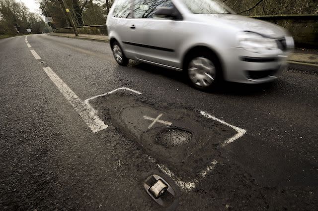 Cars pass a deep potholed road in Gloucestershire, which along with most of the South West UK, needs attention and repair work after a year of heavy rainfall and recent flooding, creating potholes and debris. PRESS ASSOCIATION Photo. Picture date: Sunday January, 6, 2013. Photo credit should read: Ben Birchall/PA Wire