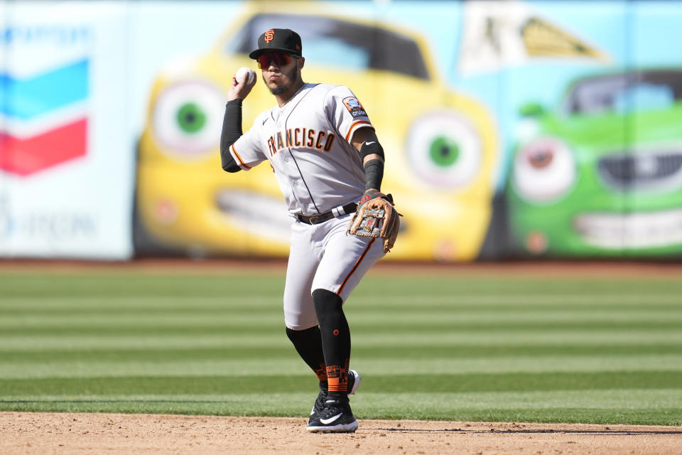San Francisco Giants second baseman Thairo Estrada throws out Oakland Athletics' Shea Langeliers at first base during the second inning of a baseball game in Oakland, Calif., Saturday, Aug. 5, 2023. (AP Photo/Jeff Chiu)