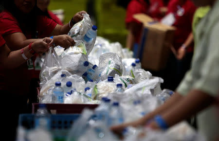 Plastic bags and bottles are given out during an event in Singapore, April 28, 2018. Picture taken April 28, 2018. REUTERS/Feline Lim