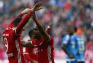 Football Soccer - Bayern Munich v Hamburg SV - German Bundesliga - Allianz Arena, Munich, Germany - 25/02/17 - Robert Lewandowski and Douglas Costa celebrate Bayern Munich goal v Hamburg SV. REUTERS/Michaela Rehle.