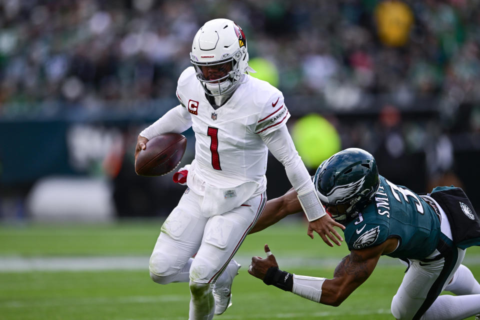 Arizona Cardinals quarterback Kyler Murray (1) runs with the ball as Philadelphia Eagles linebacker Nolan Smith (3) tries to stop hime during the second half of an NFL football game, Sunday, Dec. 31, 2023, in Philadelphia. (AP Photo/Derik Hamilton)