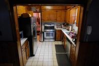 <p>The kitchen is built with timber cabinets.</p>