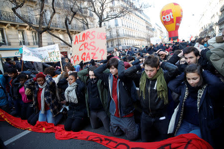 People attend a CGT labour union demonstration to protest against the French government's reforms in Paris, France, December 14, 2018. REUTERS/Gonzalo Fuentes