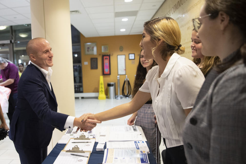 U.S. Rep. Max Rose greets interns working for his administration as he arrives for a town hall meeting, Wednesday, Oct. 2, 2019, at the Joan and Alan Bernikow Jewish Community Center in the Staten Island borough of New York. (AP Photo/Mary Altaffer)