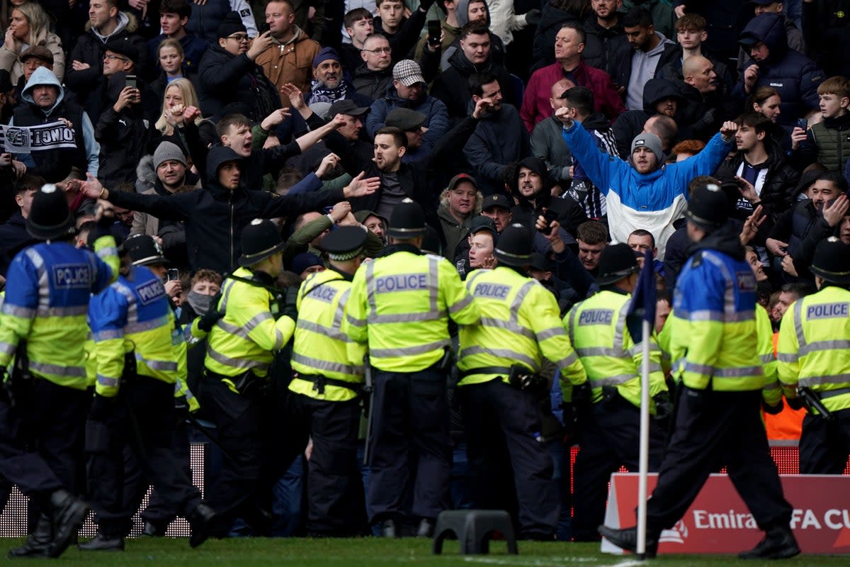 Police officers attempt to contain trouble between rival fans during West Brom’s FA Cup fourth round tie against Wolves (Bradley Collyer/PA). (PA Wire)