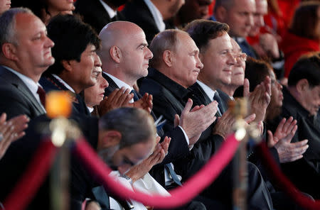 Russian President Vladimir Putin (5th L), FIFA President Gianni Infantino (4th L) and Bolivian President Evo Morales (2nd L) attend a gala concert, dedicated to the upcoming 2018 FIFA World Cup, in Red Square in Moscow, Russia June 13, 2018. Sergei Chirikov/Pool via REUTERS