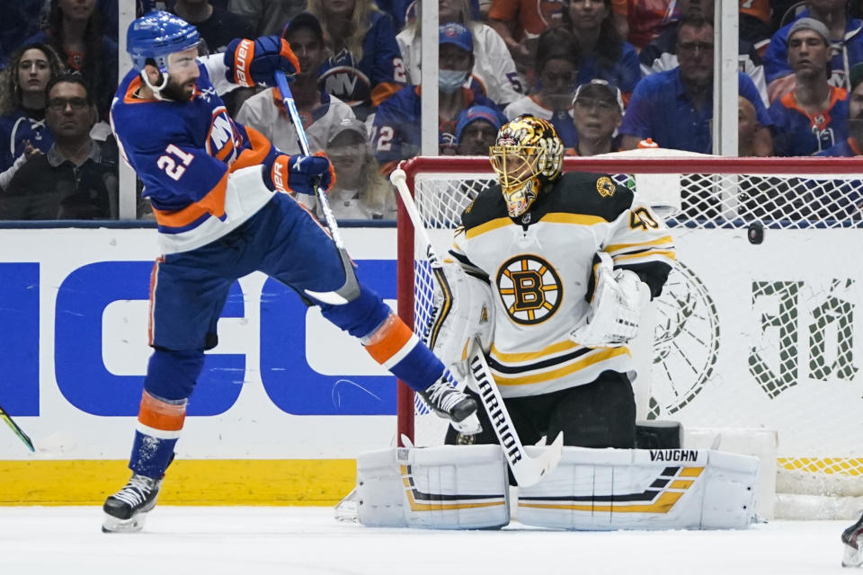 Boston Bruins goaltender Tuukka Rask (40) stops a shot on goal by New York Islanders' Kyle Palmieri (21) during the first period of Game 6 during an NHL hockey second-round playoff series Wednesday, June 9, 2021, in Uniondale, N.Y. (AP Photo/Frank Franklin II)