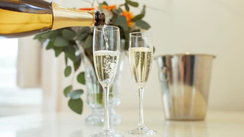 Sparkling wine poured into flutes