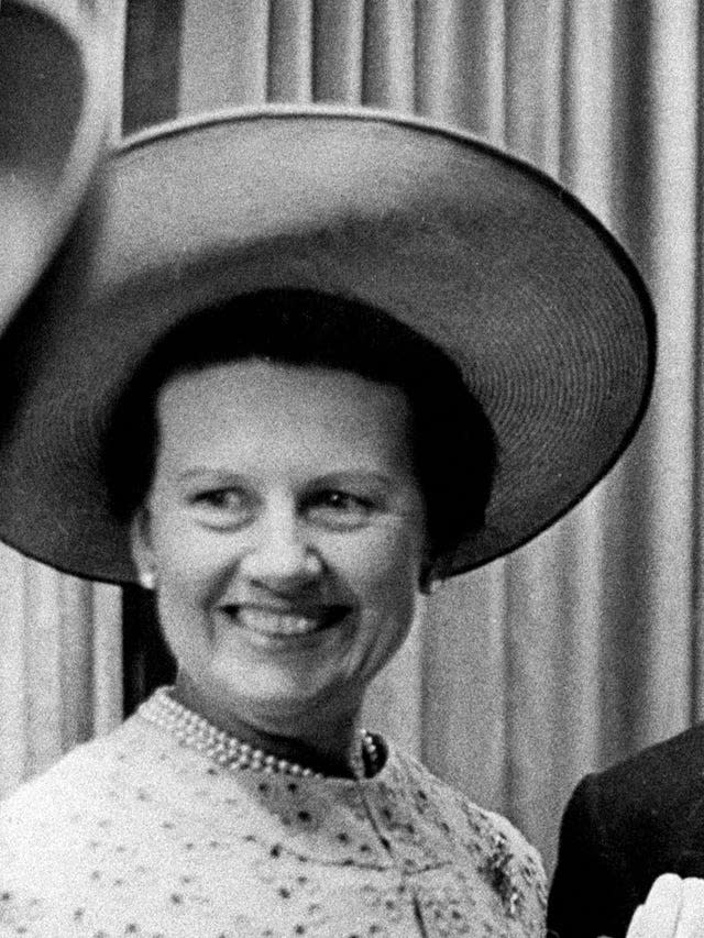 Black and white photo of a woman in a large hat