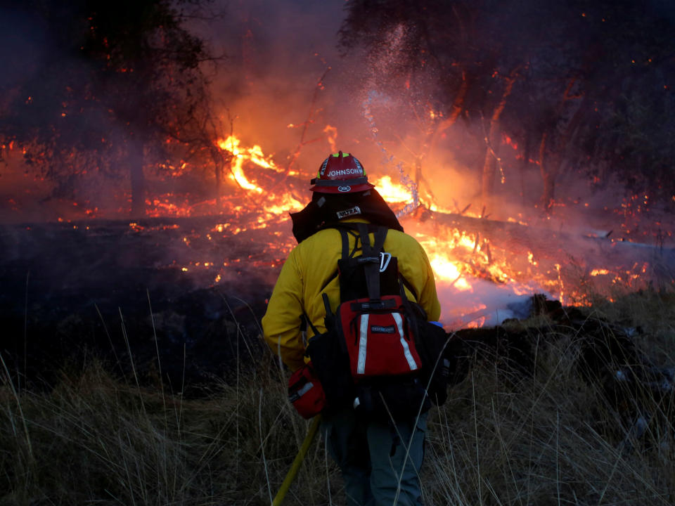 Firefighters battle a wildfire near Santa Rosa: REUTERS/Jim Urquhart