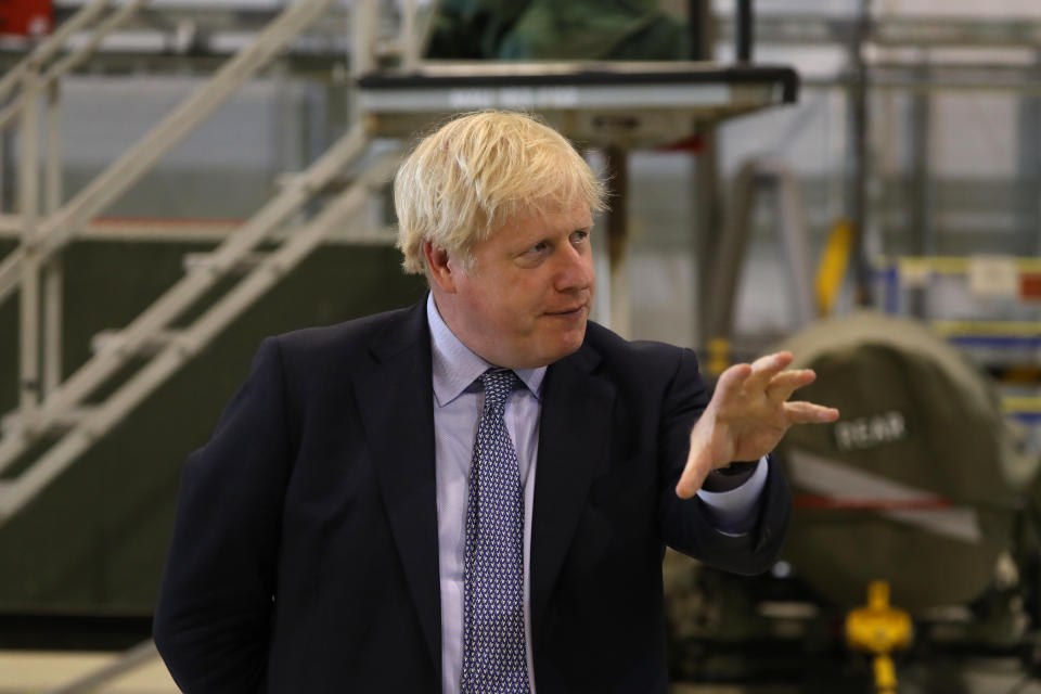 LOSSIEMOUTH, SCOTLAND - JULY 23: Prime Minister Boris Johnson looks at a Typhoon fighter jet at RAF Lossiemouth, Moray, during a visit to the Highlands and Northern Isles of Scotland on July 23, 2020 in Lossiemouth, Scotland. This week marks one year as U.K. Prime Minister for Conservative Party leader Boris Johnson. Today he is visiting businesses in the Orkney Islands in Scotland to reaffirm his commitment to supporting all parts of the UK through the Coronavirus pandemic. Later he will visit a military base in Moray to thank Military personnel for their service. (Photo by Andrew Milligan - WPA Pool/Getty Images)