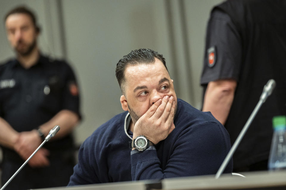 Former nurse Niels Hoegel, left, accused of multiple murder and attempted murder of patients, attends a session of the district court in Oldenburg, Germany, Wednesday, June 5, 2019. (Mohssen Assanimoghaddam/dpa via AP, Pool)